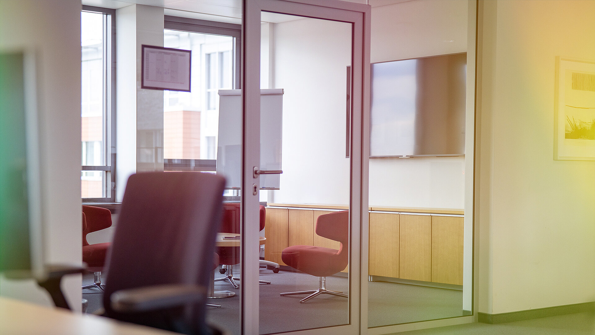 Modern, open-plan working environment with seating.