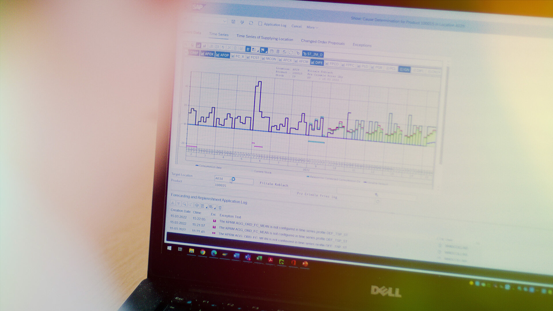 A person looking at a graph on a laptop.