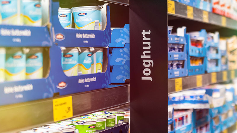Shelf with yoghurt and dairy products.